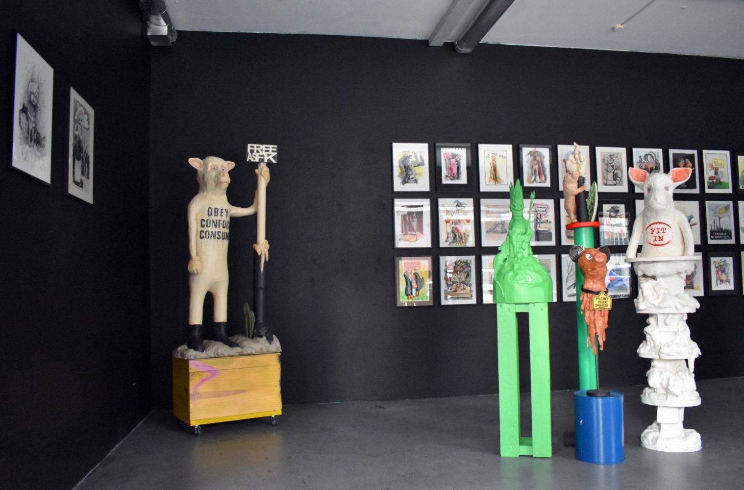 Installation view of The Way Things Seem at Gallery Daeppen, Basel, with sculptures and framed drawings against dark walls.