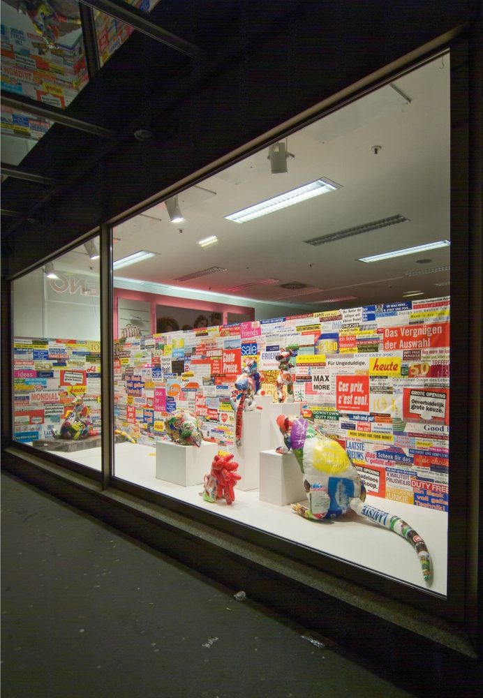 Exterior view of the illuminated shop-window installation Paradise is here 2 in Linz.