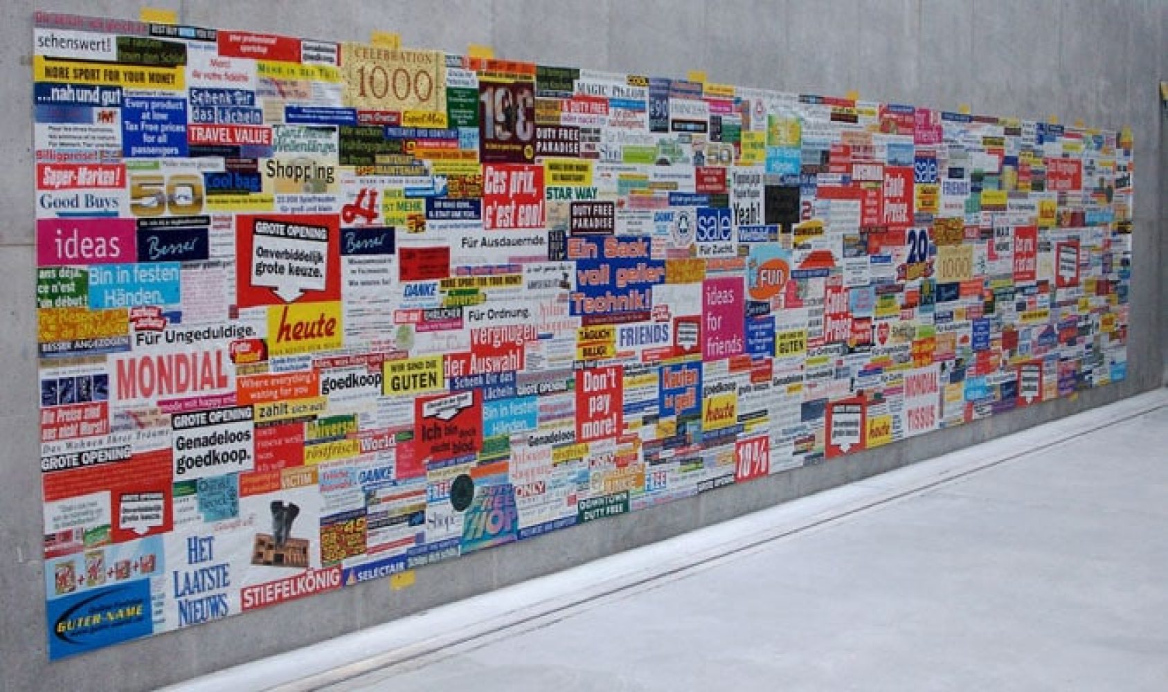 Large advertising tapestry made from cut-up commercial plastic shopping bags in a studio in Linz.