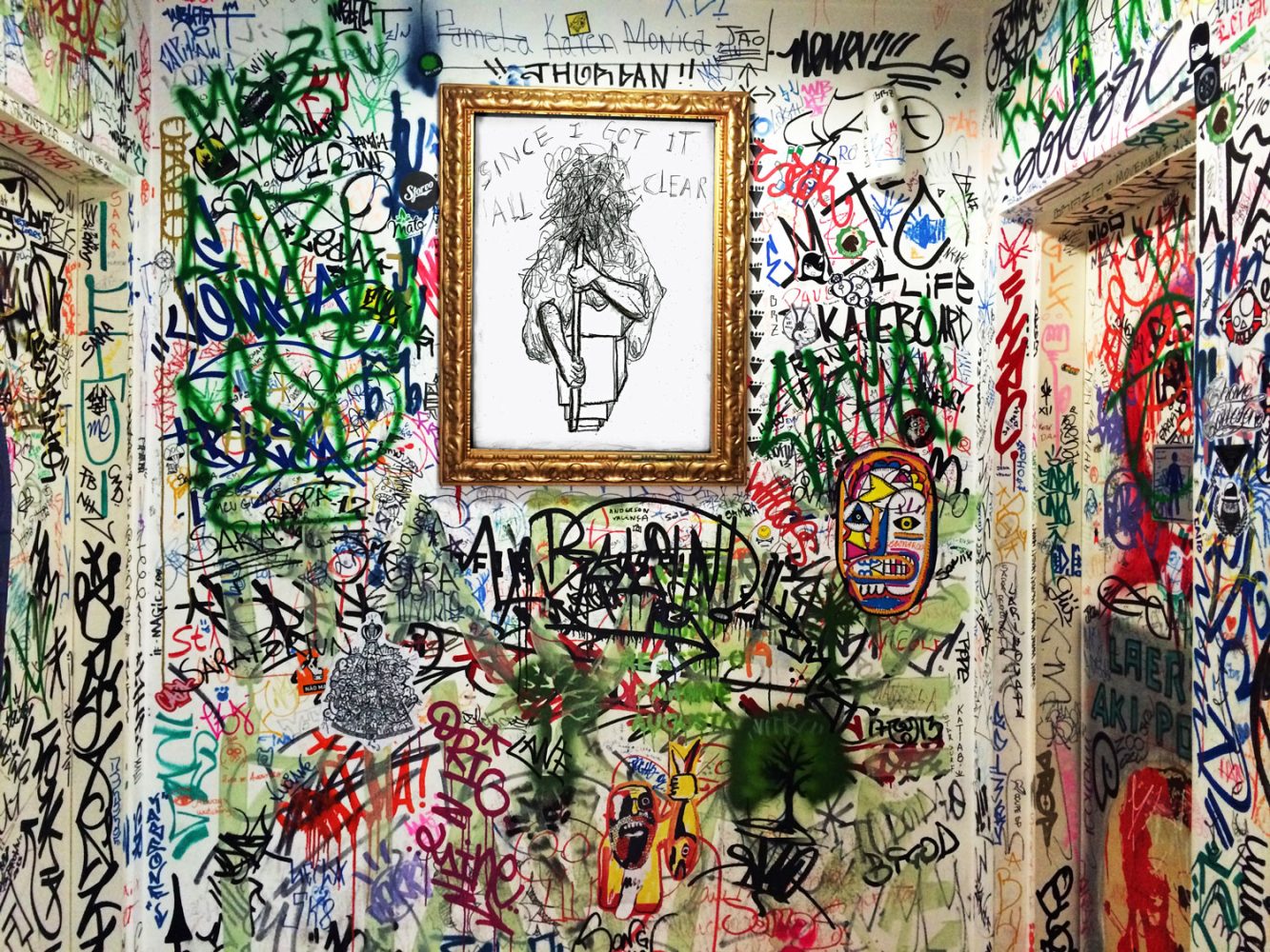 Graffiti-covered interior with a framed Thinking Crack drawing at the centre.