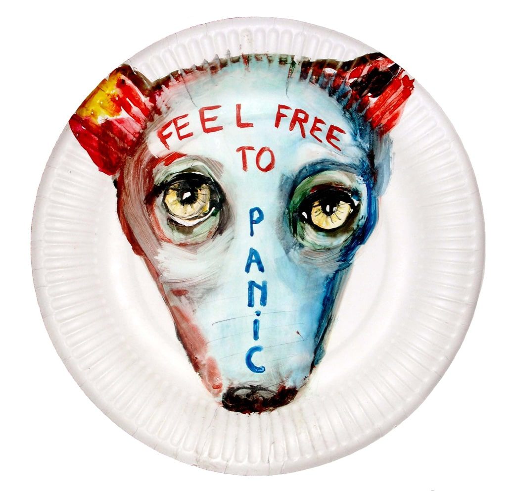 Watercolour of a pale dog face with wide eyes and the words “Feel Free to Panic” on a paper plate.